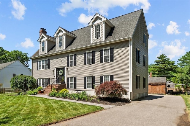 69 Kame St, Brockton, MA 02302 - view of front facade featuring a chimney and a shingled roof