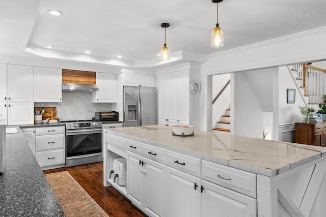 69 Kame St, Brockton, MA 02302 - kitchen with stainless steel appliances, under cabinet range hood, white cabinets, ornamental molding, and recessed lighting