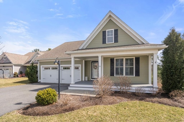 16 Winterberry Way, Plymouth, MA 02360 - view of front of property featuring a porch, a front yard, driveway, and an attached garage