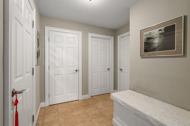 16 Winterberry Way, Plymouth, MA 02360 - hall with light tile patterned flooring and baseboards