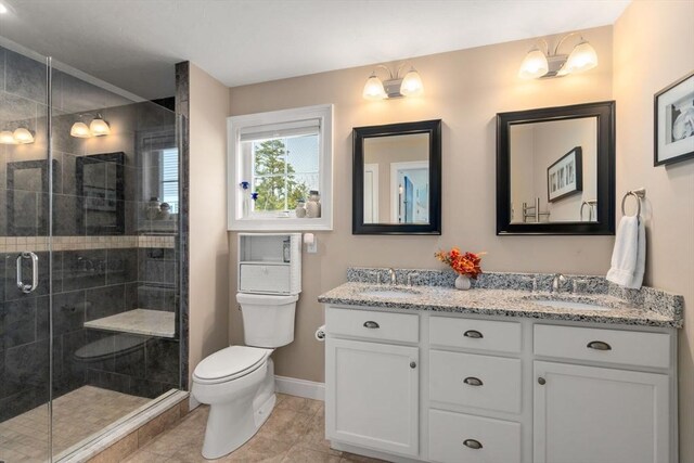 16 Winterberry Way, Plymouth, MA 02360 - full bathroom featuring toilet, double vanity, a sink, and a shower stall