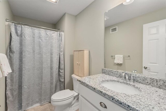 16 Winterberry Way, Plymouth, MA 02360 - full bath featuring a shower with curtain, visible vents, toilet, vanity, and tile patterned flooring