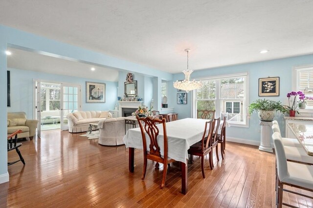 16 Winterberry Way, Plymouth, MA 02360 - dining space featuring a healthy amount of sunlight, a notable chandelier, and wood-type flooring