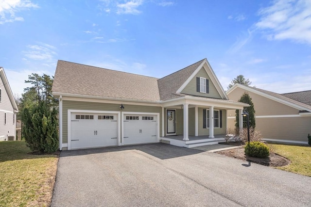 16 Winterberry Way, Plymouth, MA 02360 - view of front of property with a porch, aphalt driveway, a front yard, and an attached garage