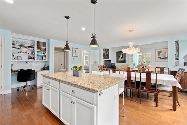 16 Winterberry Way, Plymouth, MA 02360 - kitchen featuring pendant lighting, white cabinetry, light wood-style floors, a kitchen island, and recessed lighting