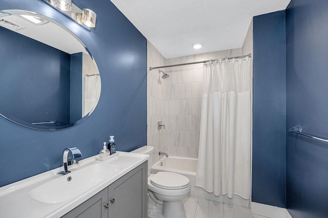 bathroom featuring vanity, shower / tub combo with curtain, tile patterned floors, and toilet