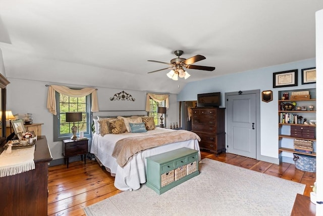 bedroom with hardwood / wood-style floors and a ceiling fan