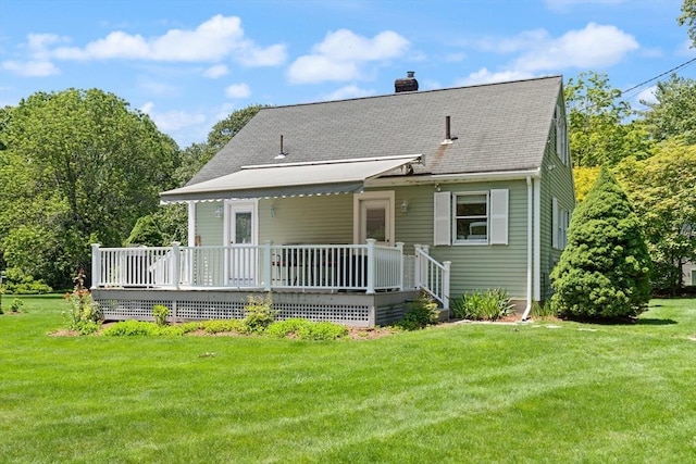 100 Parmenter Rd, Framingham, MA 01701 - back of property featuring a chimney, a wooden deck, a yard, and roof with shingles