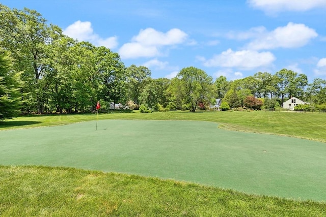 100 Parmenter Rd, Framingham, MA 01701 - surrounding community featuring an area to practice putting, a lawn, view of scattered trees, and golf course view