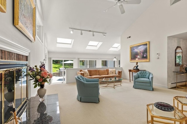 100 Parmenter Rd, Framingham, MA 01701 - carpeted living room featuring a skylight, high vaulted ceiling, a ceiling fan, a baseboard radiator, and track lighting