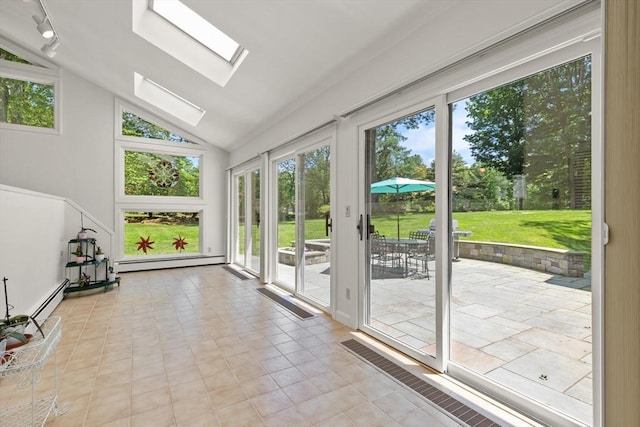 100 Parmenter Rd, Framingham, MA 01701 - doorway featuring vaulted ceiling, a skylight, and a baseboard radiator