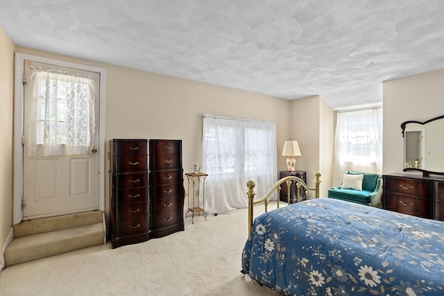 carpeted bedroom with a textured ceiling