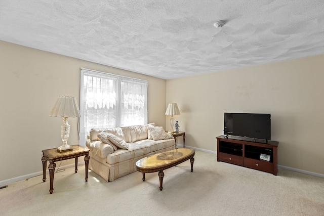 carpeted living room featuring a textured ceiling