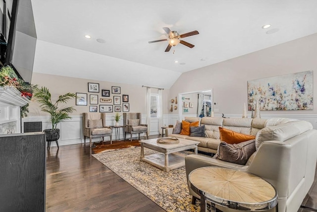 living area featuring a wainscoted wall, dark wood-type flooring, recessed lighting, lofted ceiling, and ceiling fan