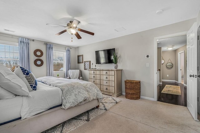 bedroom featuring visible vents, a ceiling fan, and baseboards