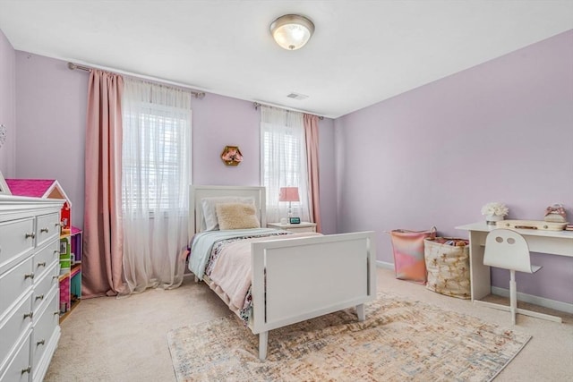 bedroom with baseboards, visible vents, and carpet floors