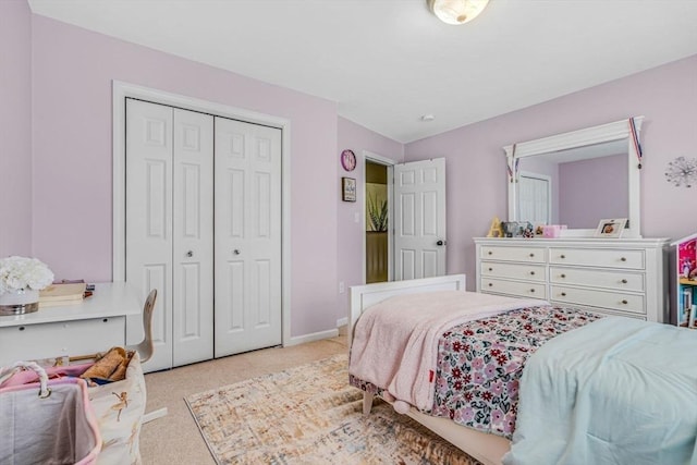 bedroom featuring baseboards, a closet, and carpet floors