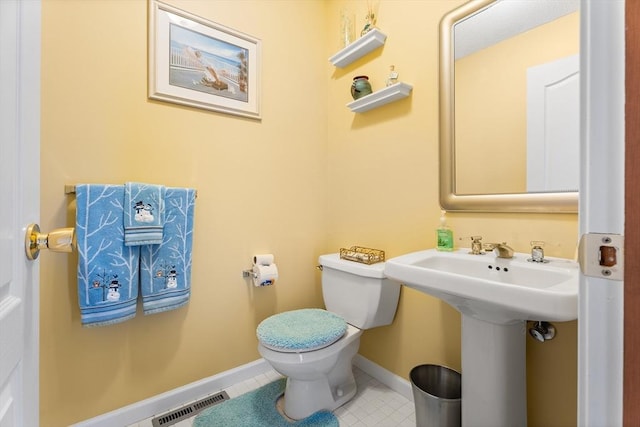 25 Ash Ln Unit 25, Agawam, MA 01001 - half bathroom with toilet, tile patterned floors, baseboards, and a sink