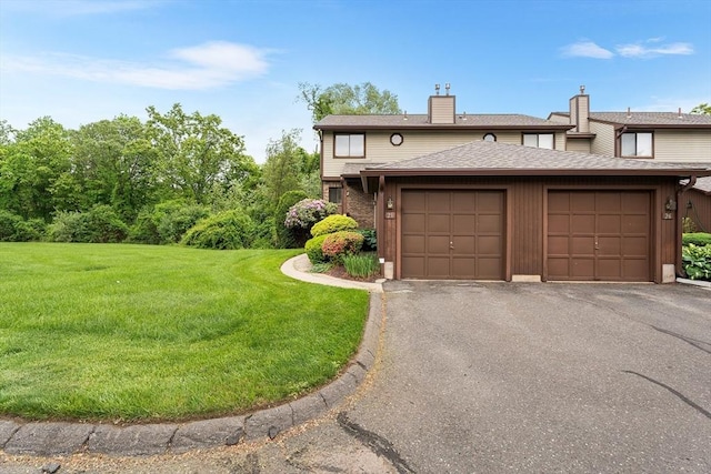 25 Ash Ln Unit 25, Agawam, MA 01001 - townhome / multi-family property featuring a chimney, an attached garage, a front lawn, asphalt driveway, and roof with shingles