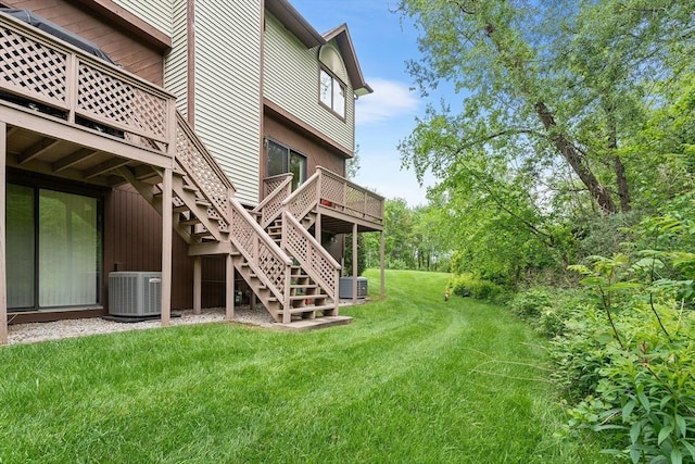 25 Ash Ln Unit 25, Agawam, MA 01001 - view of grassy yard featuring cooling unit, stairs, and a wooden deck