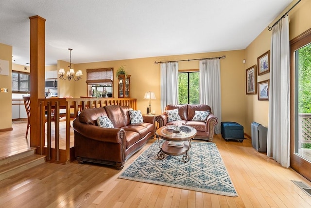 25 Ash Ln Unit 25, Agawam, MA 01001 - living area with hardwood / wood-style floors, a chandelier, and plenty of natural light