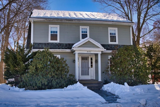 view of front facade featuring a shingled roof