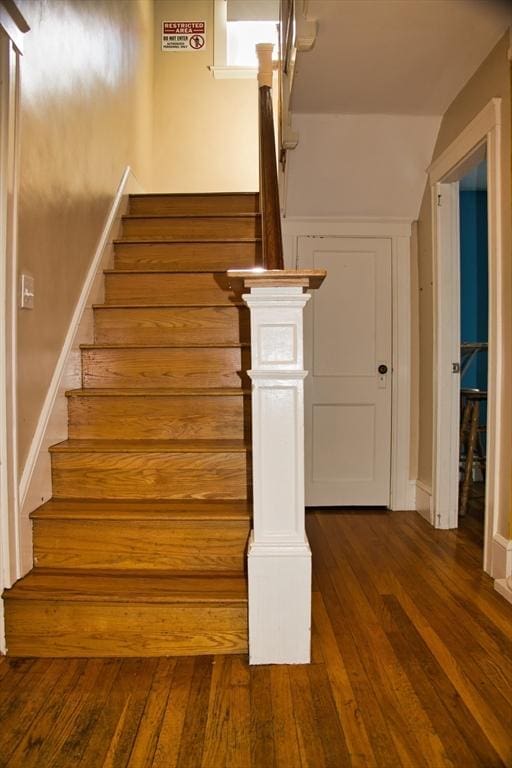 stairs with wood-type flooring