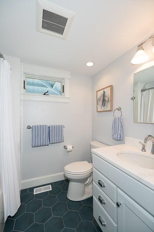84 S St, Rockport, MA 01966 - full bathroom featuring vanity, toilet, tile patterned floors, a shower with curtain, and baseboards