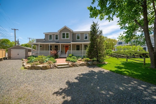 84 S St, Rockport, MA 01966 - view of front of property featuring a porch, gravel driveway, and a detached garage