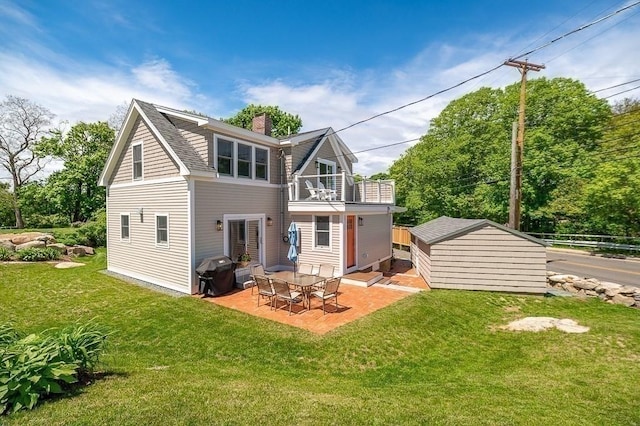 84 S St, Rockport, MA 01966 - rear view of property featuring a balcony, a chimney, a patio, and an outdoor structure