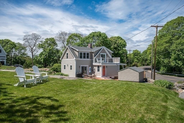 84 S St, Rockport, MA 01966 - rear view of property with a balcony, a yard, and a chimney