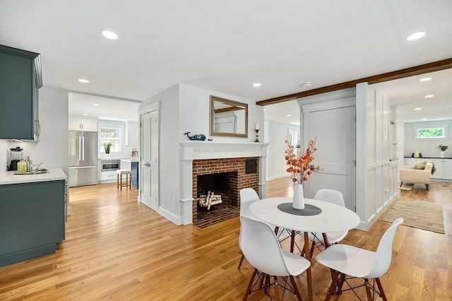 84 S St, Rockport, MA 01966 - dining space featuring light wood-style flooring, recessed lighting, and a brick fireplace