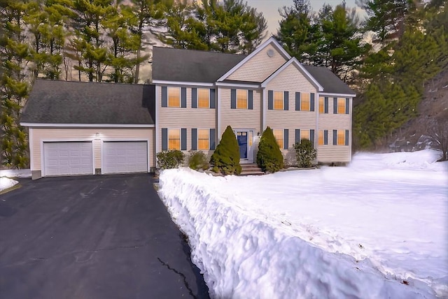 colonial home featuring a garage and driveway