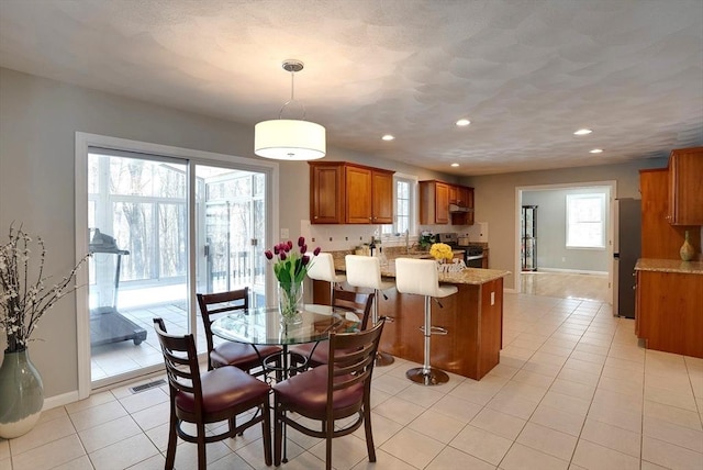 dining space featuring light tile patterned flooring, visible vents, baseboards, and recessed lighting