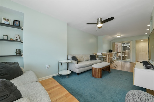 living room with ceiling fan and wood-type flooring