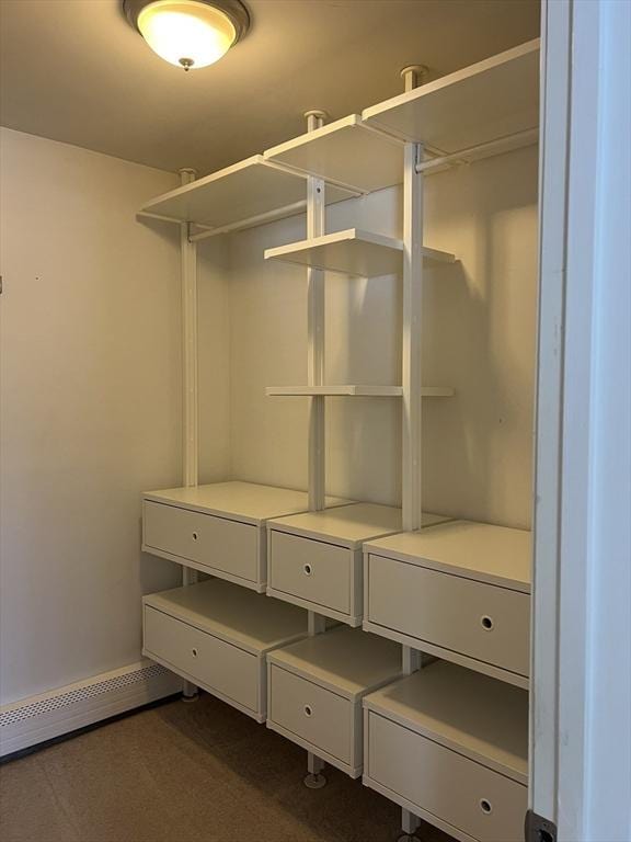 walk in closet featuring a baseboard radiator