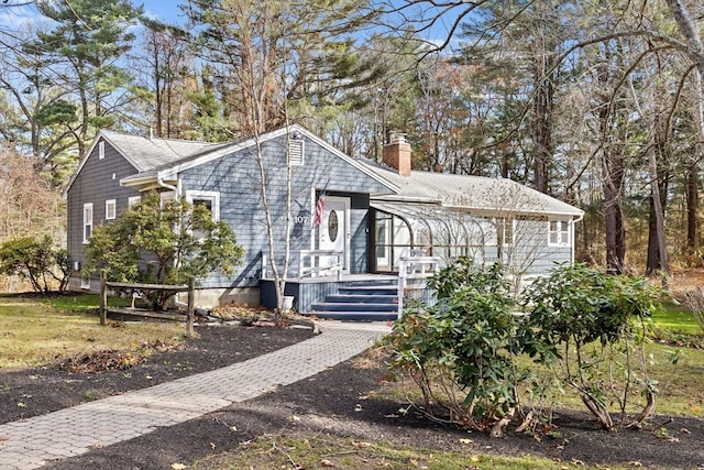 view of front of home featuring a sunroom