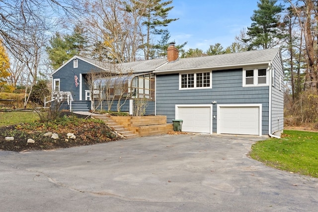 view of front of property with a sunroom and a garage