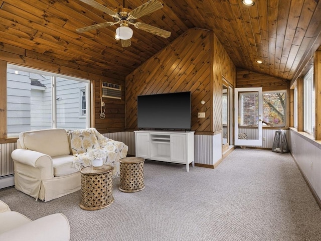 living room featuring carpet floors, wood walls, wooden ceiling, and lofted ceiling
