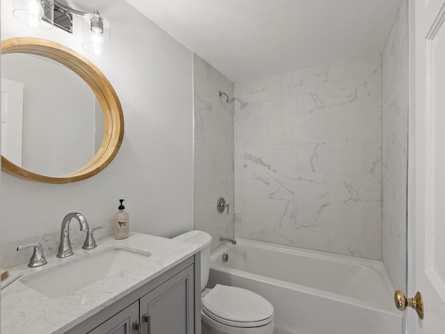 bathroom featuring toilet, bathtub / shower combination, and vanity