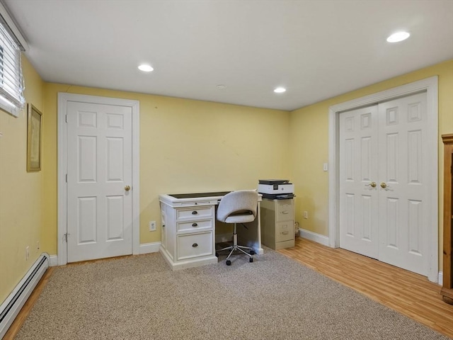 office featuring recessed lighting, baseboards, light wood finished floors, and a baseboard heating unit