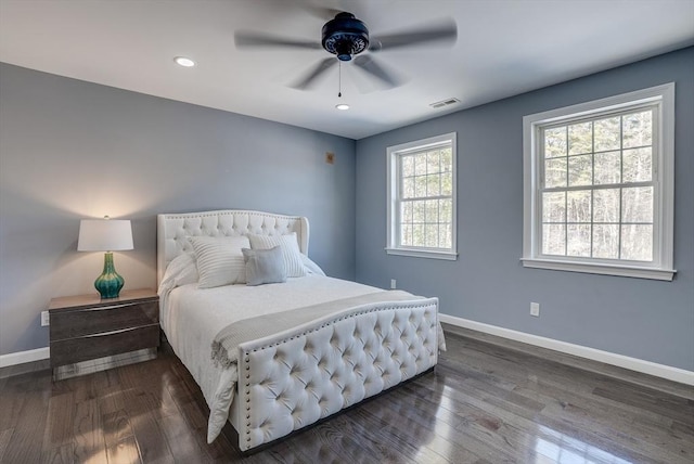 bedroom featuring dark hardwood / wood-style flooring and ceiling fan