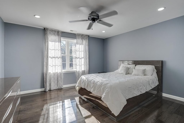 bedroom featuring ceiling fan and dark hardwood / wood-style flooring