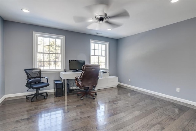 office space featuring wood-type flooring, a wealth of natural light, and ceiling fan