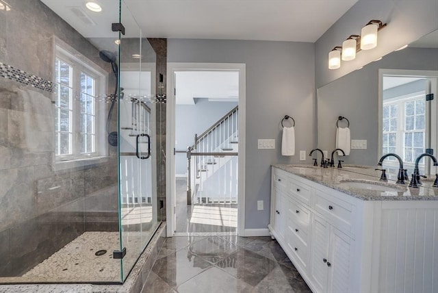 bathroom with vanity and walk in shower