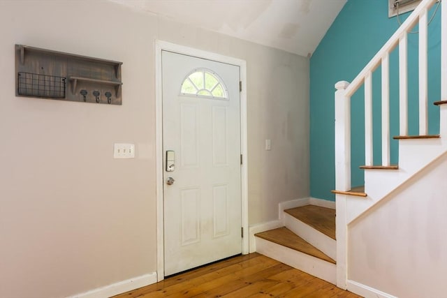 100 Kelley Rd, Barnstable, MA 02601 - entryway featuring stairs, hardwood / wood-style flooring, baseboards, and vaulted ceiling