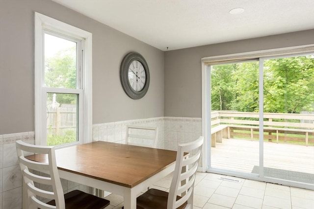 100 Kelley Rd, Barnstable, MA 02601 - dining area featuring tile walls, a wainscoted wall, and light tile patterned floors