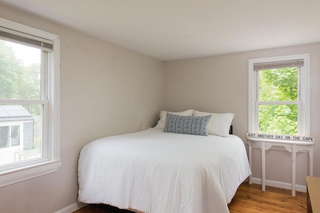 100 Kelley Rd, Barnstable, MA 02601 - bedroom with multiple windows, baseboards, and wood finished floors