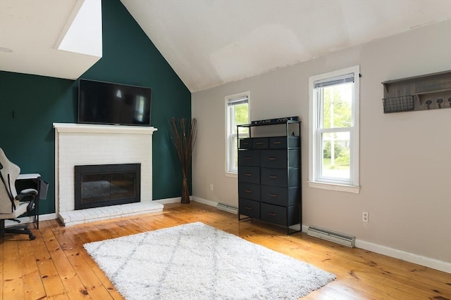 100 Kelley Rd, Barnstable, MA 02601 - living area with light wood-style floors, a fireplace, lofted ceiling, and baseboards