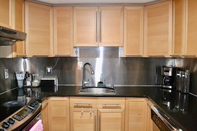 kitchen with light brown cabinetry, stainless steel electric range oven, and a sink
